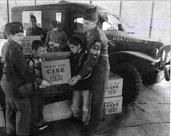 Susanne & Frank Heyn with 2 Berlin pupils in front of his WC 54 Dodge Ambulance